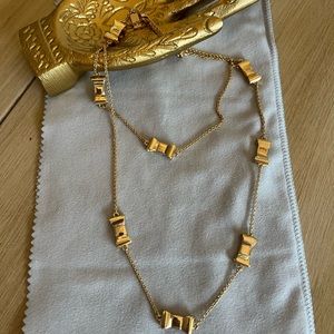 Kate Spade polished gold bow necklace, channel your inner 90s glam